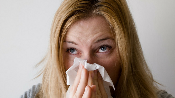 Woman Blowing her Nose